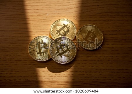 Digital currency physical gold metal coin. Cryptocurrency concept.