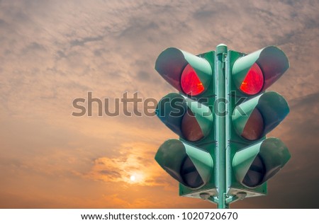 Traffic light on the sky background