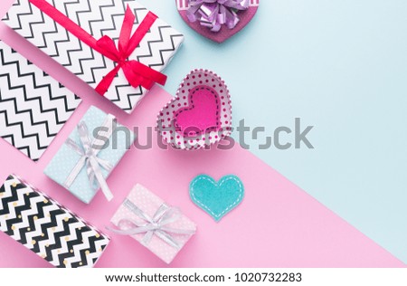 Person holding a present for Saint Valentine's day in his hands. Beautiful colorful background to st. Valentine day. Greeting card with red hearts. Wedding's invitation. Love expression. 