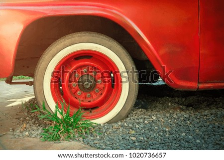 Vintage and retro background concept. Transportation and travel background. Red wheel of vintage car. Picture for add text message. Backdrop for design art work.