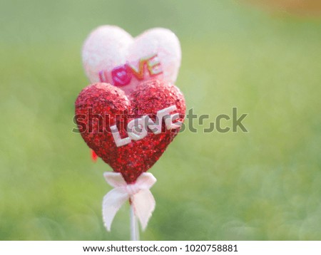 Pink and red hearts have a love letter background. There are bokeh bubbles for Valentine's Day. 14 Feb is a day to express. Giving love