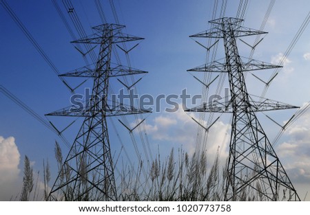 Electric pole with cloudy sky on the background