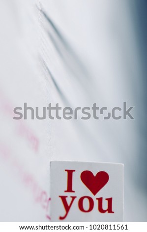 I love you message in the paper with beautiful background, special word about feeling love for valentine’s day, love message for everyone in special days.