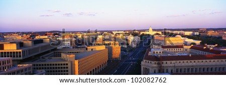 This is an aerial view of Washington, DC showing Pennsylvania Avenue to the U.S. Capitol at sunset.