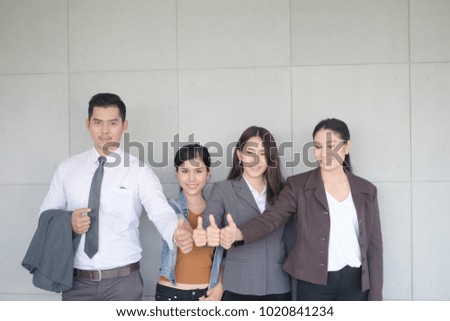 group of people show ok or confirm with thumb up