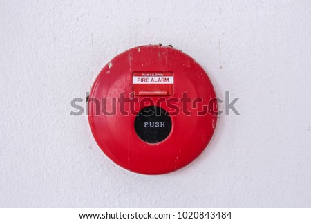 old fire alarm and white wall concrete background