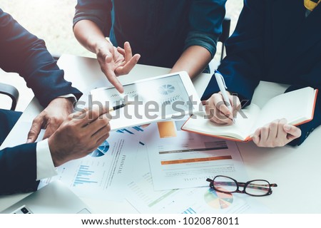 Asian business adviser meeting to analyze and discuss the situation on the financial report in the meeting room.Investment Consultant,Financial Consultant,Financial advisor and accounting concept Royalty-Free Stock Photo #1020878011