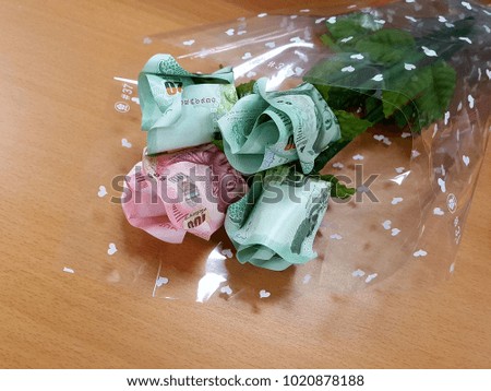Bouquet of roses Handicraft made of Thai banknotes for spcial gift. Concept valentine day and love.