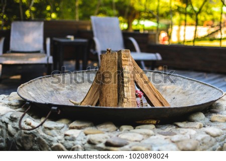 Fire place in a patio with wood inside