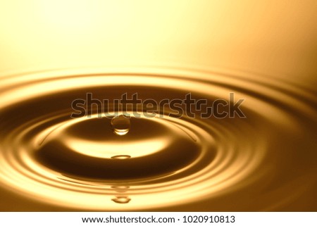 Water Drop - Pure clear and transparent of water and ripple in gold background. Creative modern concept, for graphic design, website, poster, placard and wallpaper.