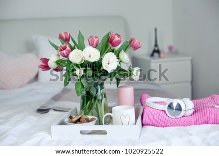 Romantic breakfast in bed. Bouquet of flowers. Roses and tulips. Spring. Valentine's Day. International Women's Day. Cozy. Summer.