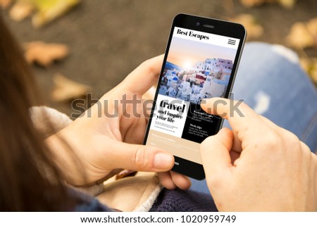 mobile design concept: woman holding a 3d generated smartphone with travel website on the screen. Graphics on screen are made up.