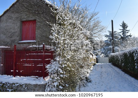 Snow in a village of parisian region - France