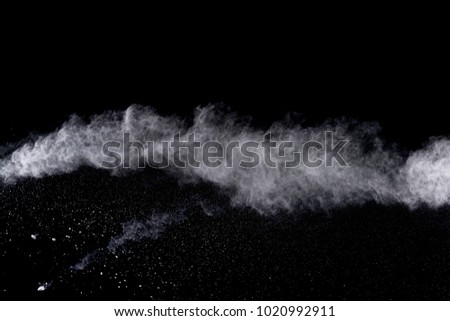 abstract powder splatted background. wihte powder explosion on black background. Colored cloud. Colorful dust explode. Paint Holi.