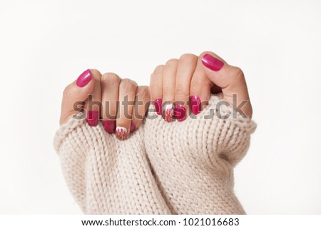 women's hands with beautiful manicure. Gestures with hands. hands holding a sweater