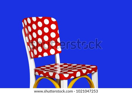 colorful chair with white balls