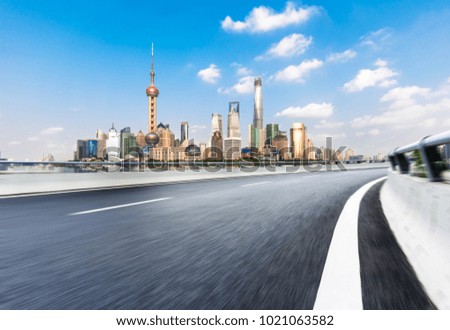 empty road with panoramic cityscape
