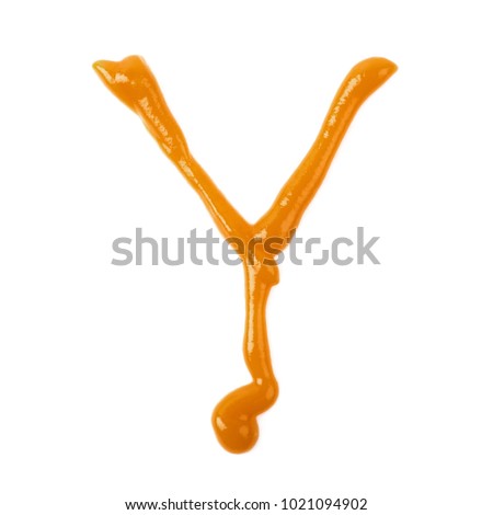 Single latin letter Y made of food sauce isolated over the white background