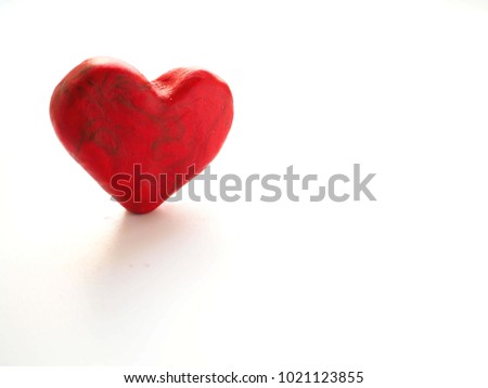 Clay figure: Heart on white background. 
