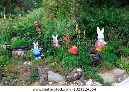 sculptures of rabbit models in the garden


