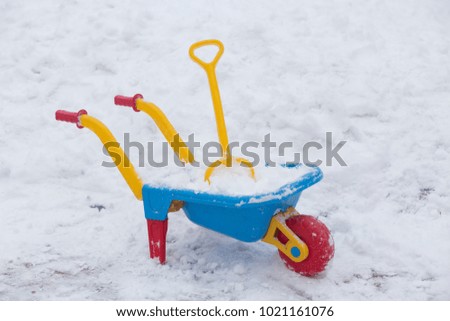 Wheelbarrow toy  with snow