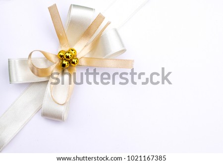 Elegance satin golden beige   ribbon isolated on white background.