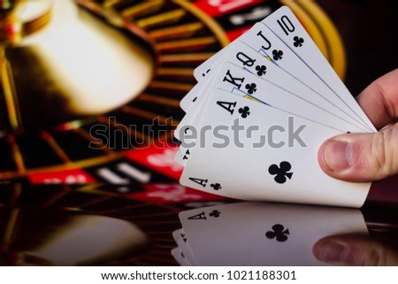 Royal flush poker cards combination on blurred background casino luck fortune card game