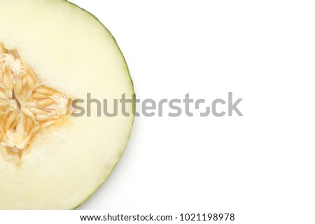 One melon Piel de Sapo round slice (Santa Claus Christmas variety) top view isolated on white background
