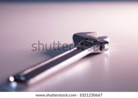 adjustable wrench on the white table