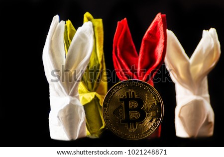 Crypto currency Gold Bitcoin, BTC, macro shot of Bitcoin coins with bunny napkin,  bitcoin and easter concept