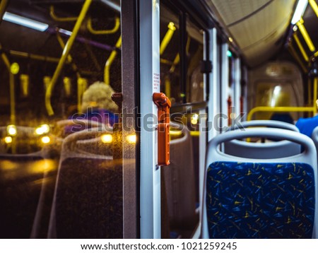 bus seat near the window, night lights