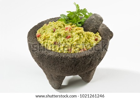 Mexican Guacamole in Molcajete
Guacamole prepared in a traditional volcanic stone bowl called molcajete Royalty-Free Stock Photo #1021261246