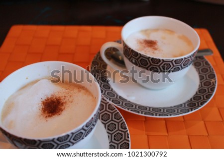 Couple Cup Of Cappuccino With Whipeed Cream Over French Table, horizontal picture