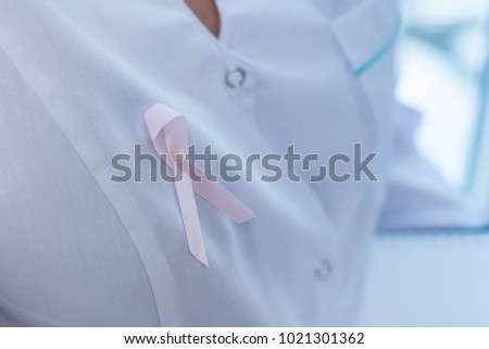 Female doctors on winter background, Cancer Day concept
