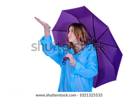 Young attractive woman in raincoat w on white