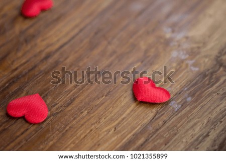Small heart on a wooden background
