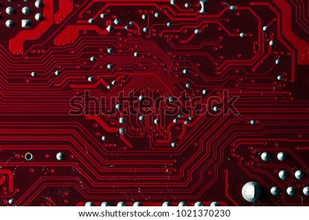 Macro picture of red printed circuit board - PCB
