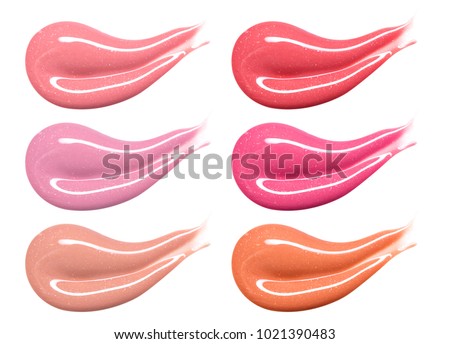 Set of different lip glosses pastel color smear samples isolated on white. Smudged makeup product sample. Royalty-Free Stock Photo #1021390483