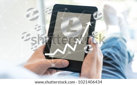Litecoin with man using a tablet computer