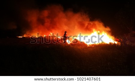 Firefighter trying to stop bushfire at Malacca, Malaysia.