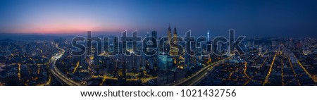 Panorama aerial view in the middle of Kuala Lumpur cityscape skyline .Night scene before sunrise , Malaysia . Royalty-Free Stock Photo #1021432756