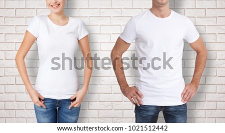 Shirt design and people concept - close up of young man and woman in blank white tshirt front and rear. Mock up for design.