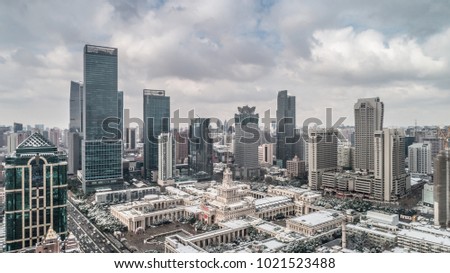 aerial view of Shanghai cityscape and skyscrapers after snowfall