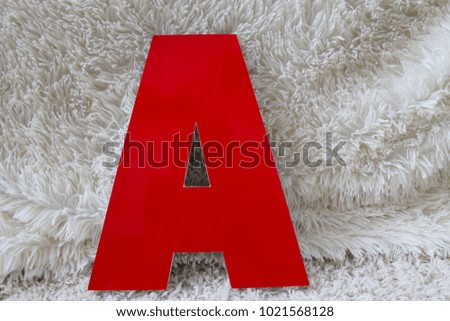 

three-dimensional red letter on a light background