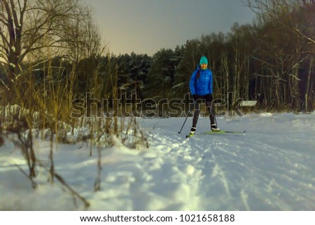 Image of woman skiing in park