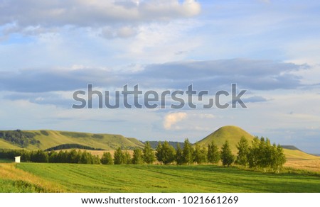 summer landscape with mountain and blue sky with clouds