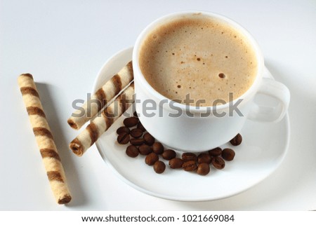 Cappuccino and sweets on white background