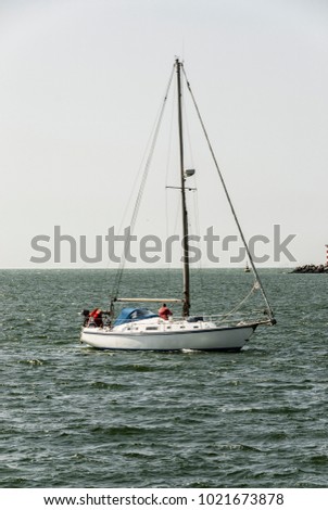small sailing yacht near the coast