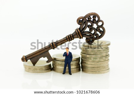 Miniature people: Businessmen stand with keys. Image use for key man, the key to success, business concept.