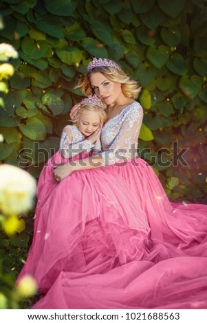 Cute little princess asleep in the arms of my mother in the park
